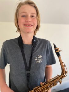 Caiden is a happy sax player