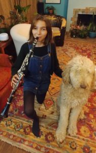 Evie with her clarinet and dog, Kuma