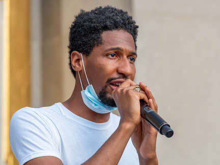 Musicians Jon Batiste and Matthew Whitaker playing piano and melodica for a "Juneteenth celebration + voter registration recital" called "We Are" on June 19, 2020. On the steps of the Brooklyn Public Library in Grand Army Plaza