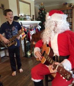 Alan Patterson and guitar-playing Santa