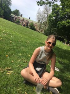 Elinor enjoying a sunny day on Reed College campus