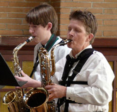 Kate playing baritone sax in a quartet