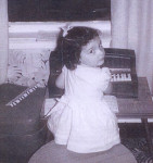 Young Mary Ellen at the piano
